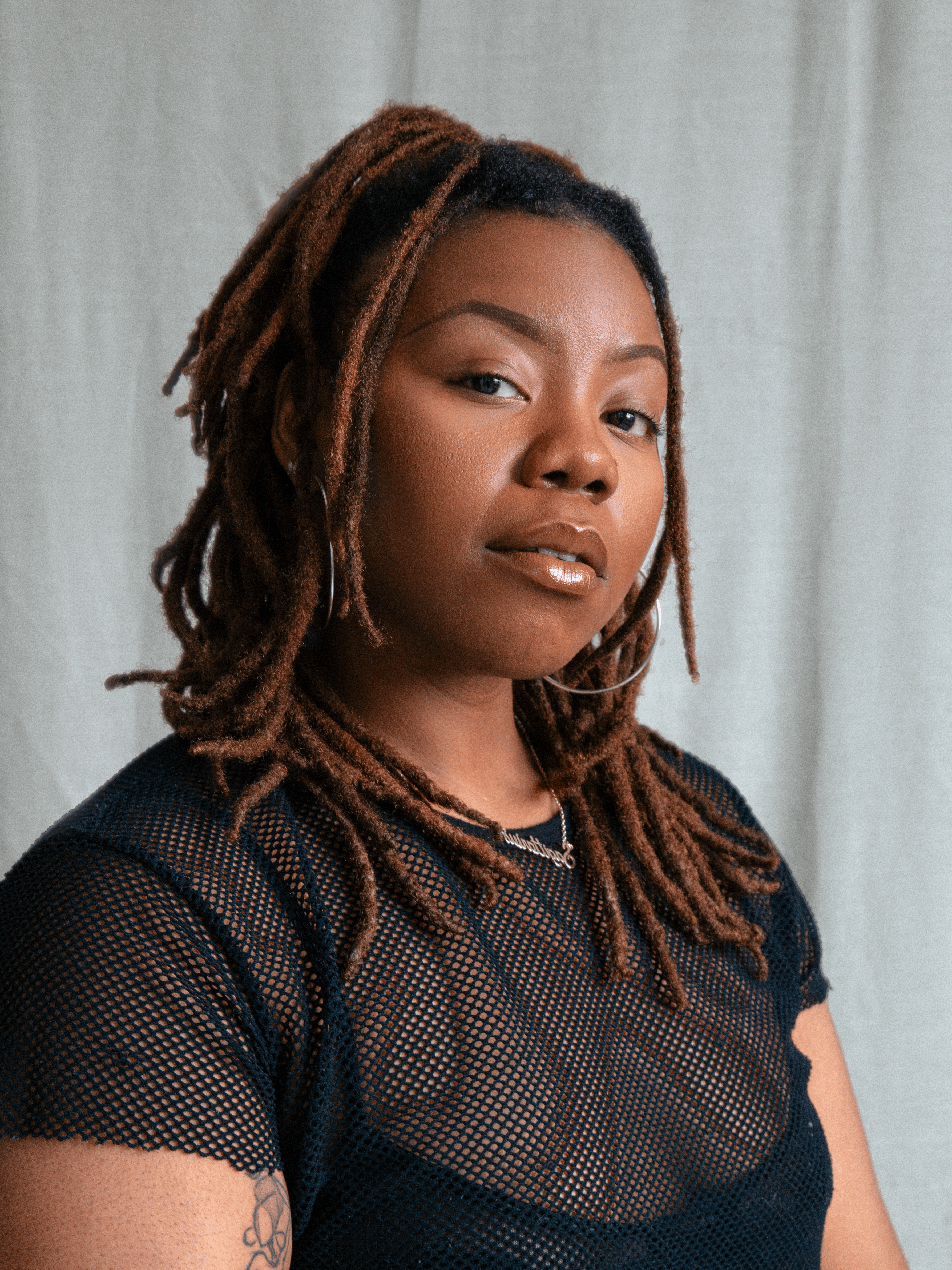 Ewa Dina, London-based director, actor & facilitator. Professional headshot in neutral tones.