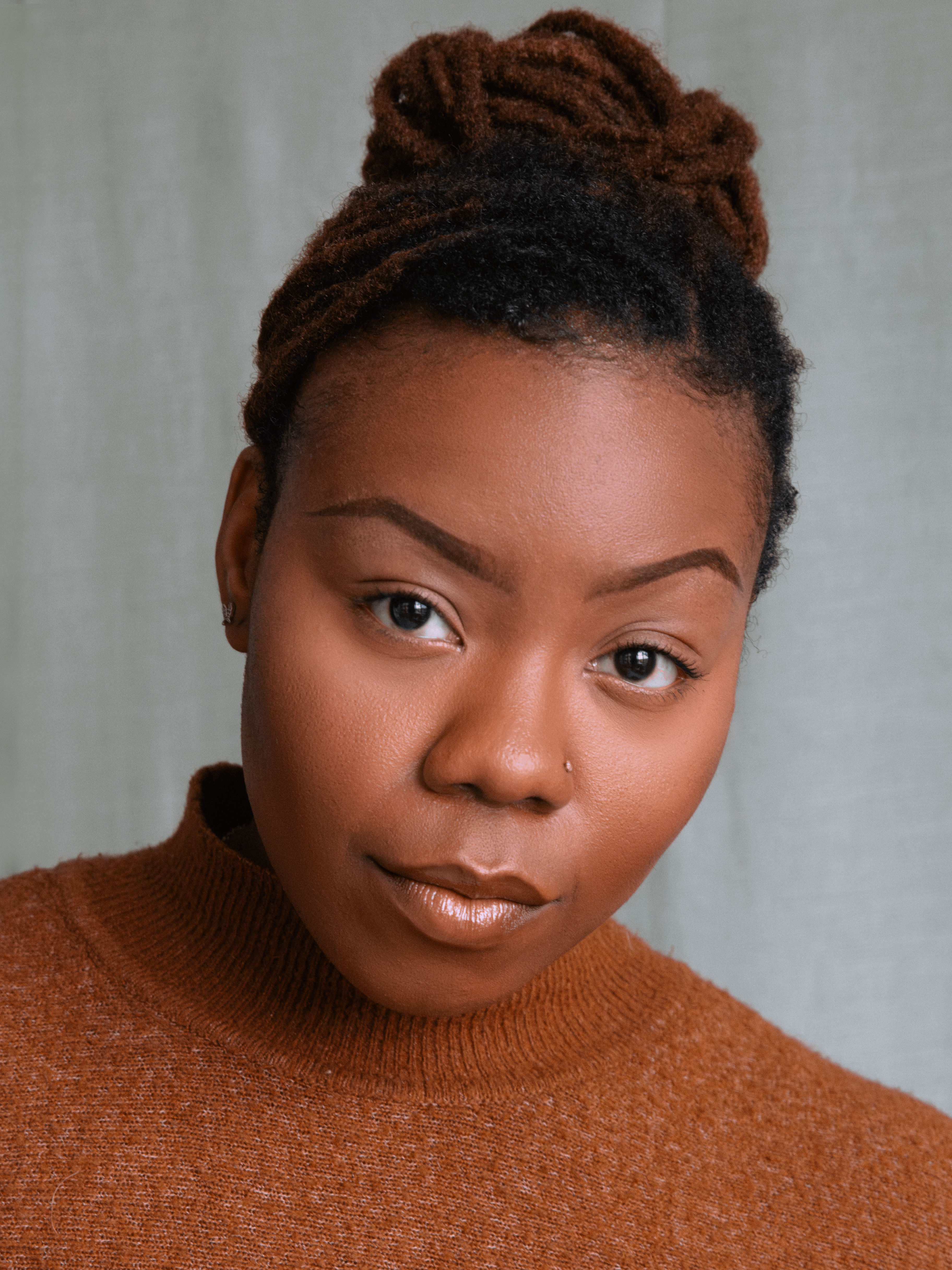 Ewa Dina, London-based director, actor & facilitator. Professional headshot in neutral tones.